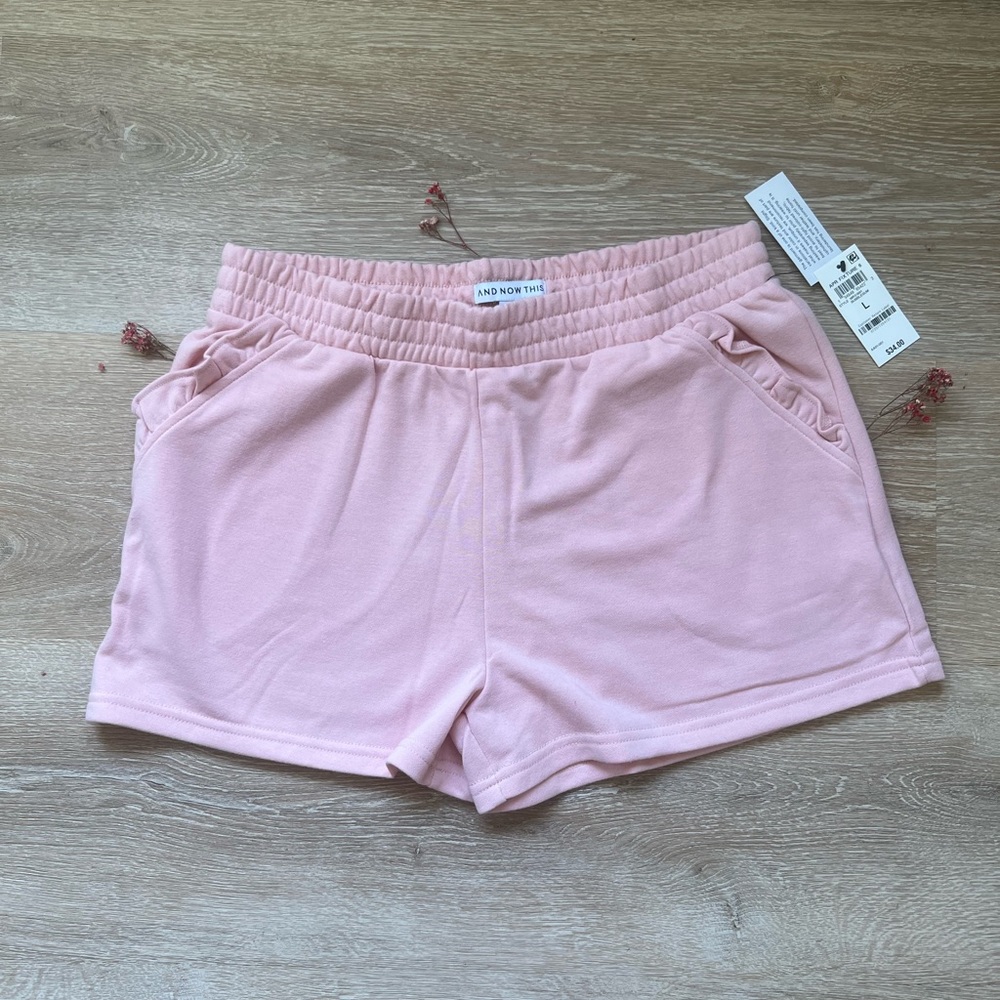 “And Now This” pink shorts 🩳.